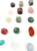 Collection of various stones and crystals on a white background