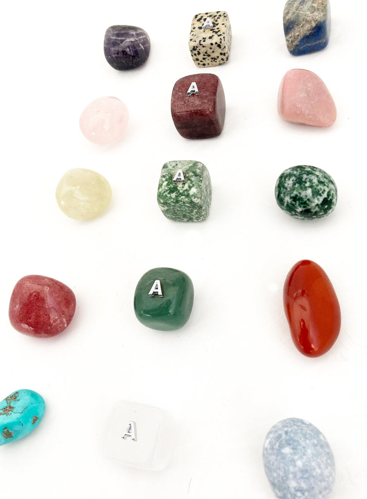 Collection of various stones and crystals on a white background