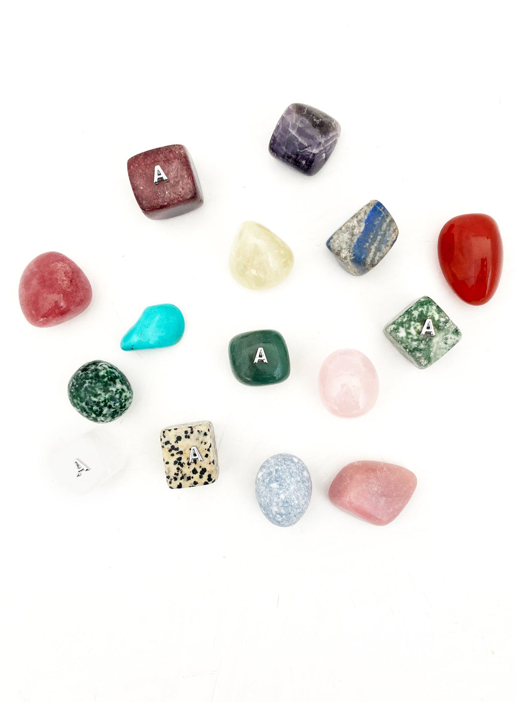 Collection of various stones and crystals on a white background