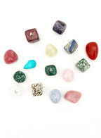 Collection of various stones and crystals on a white background