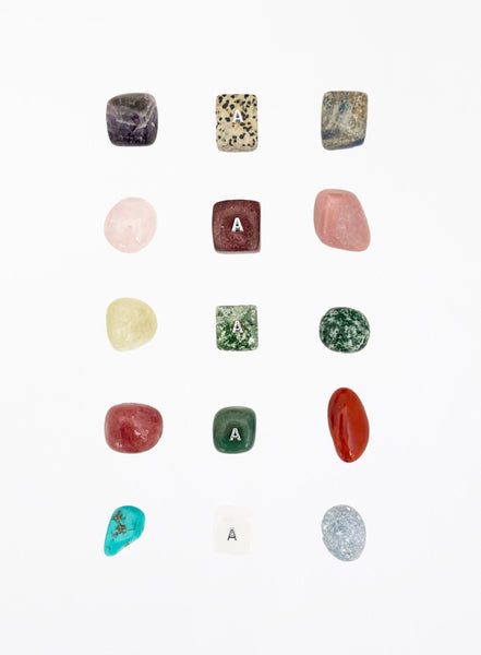Collection of various stones and crystals on a white background