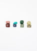 multicoloured crystal stones set in white background
