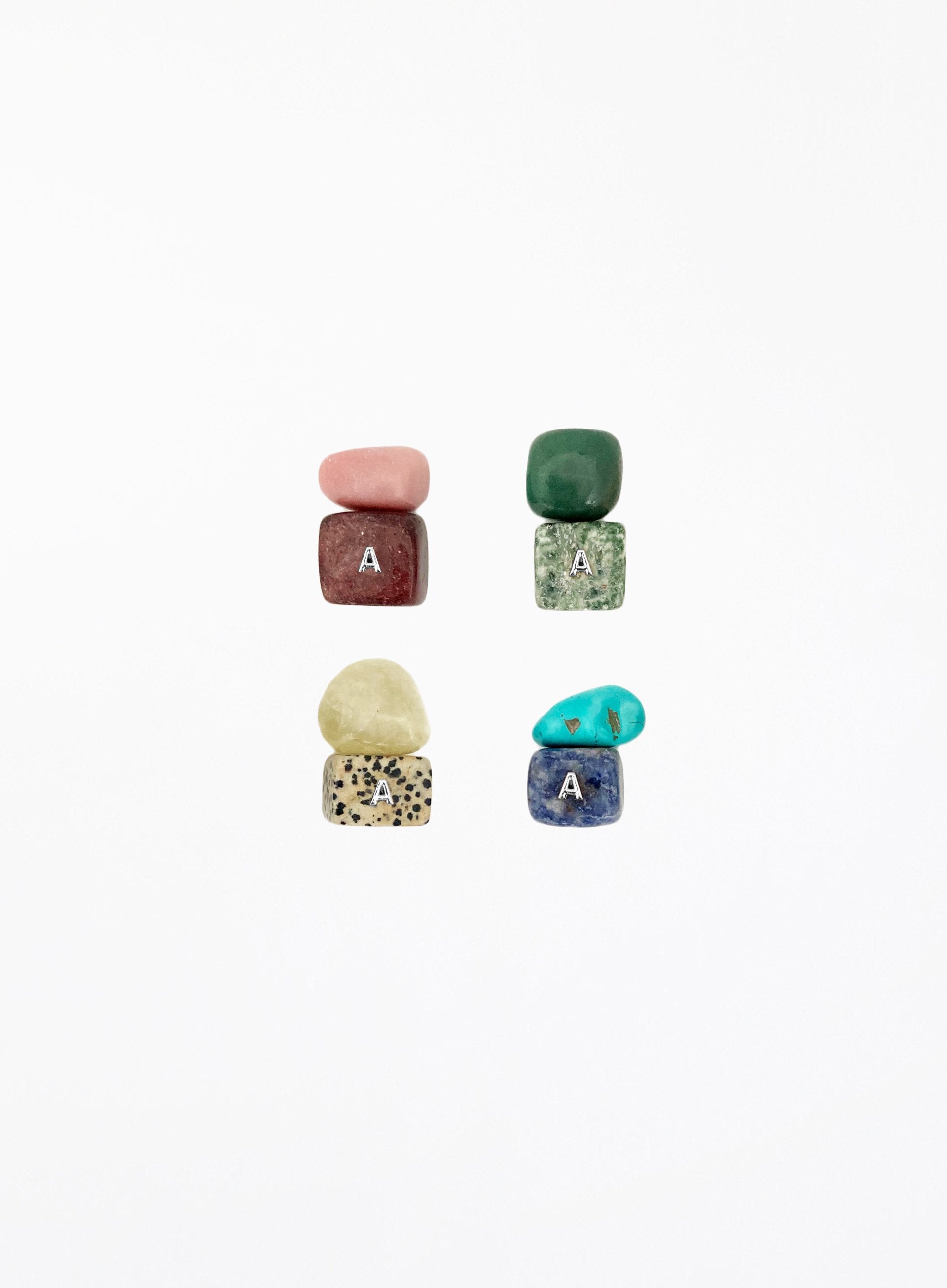 multicoloured crystal stones set in white background