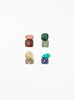 multicoloured crystal stones set in white background