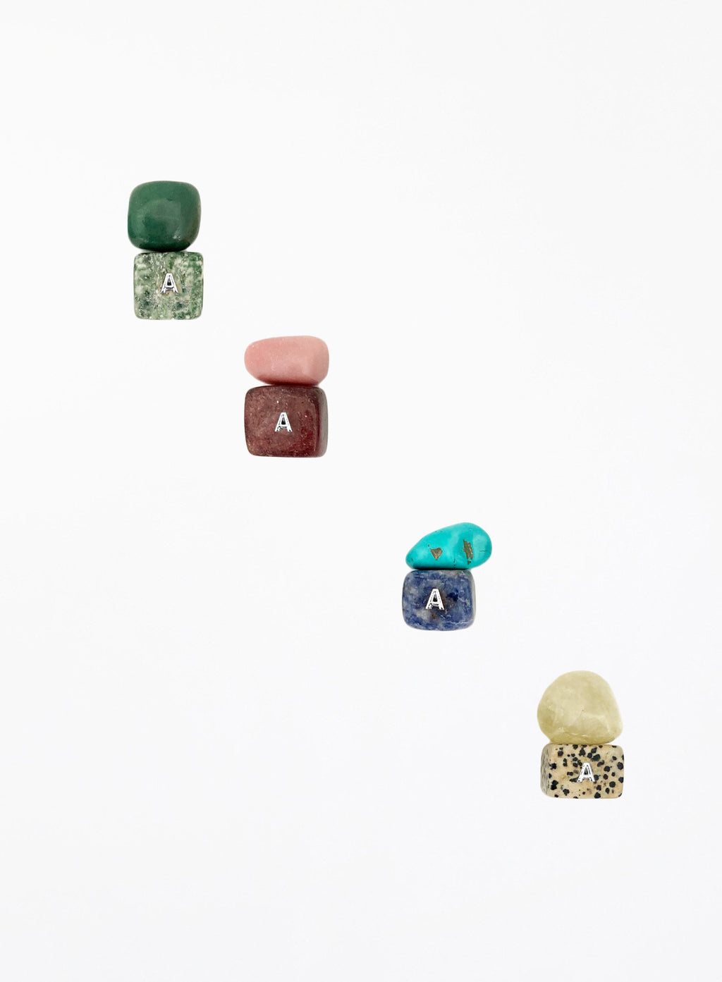 multicoloured crystal stones set in white background