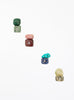 multicoloured crystal stones set in white background