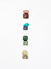 multicoloured crystal stones set in white background