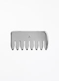 A silver metal hair-tooth comb with a small engraved letter 'A' in the center, shown against a plain white background.