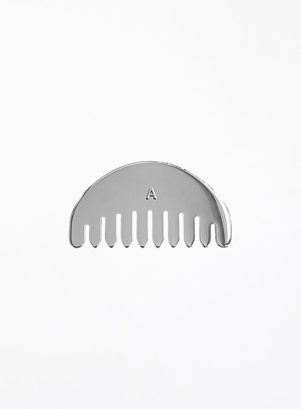 A silver metal hair comb with a semi-circular back and a small engraved letter 'A' in the center, shown on a plain white background.