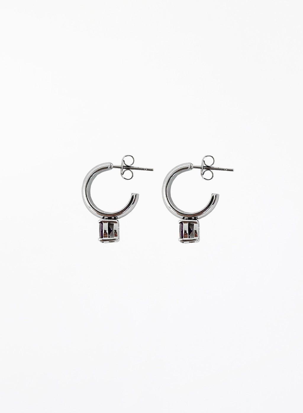 Pair of silver hoop earrings on a white background