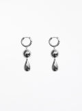 Pair of silver hoop earrings with teardrop-shaped charms on a white background