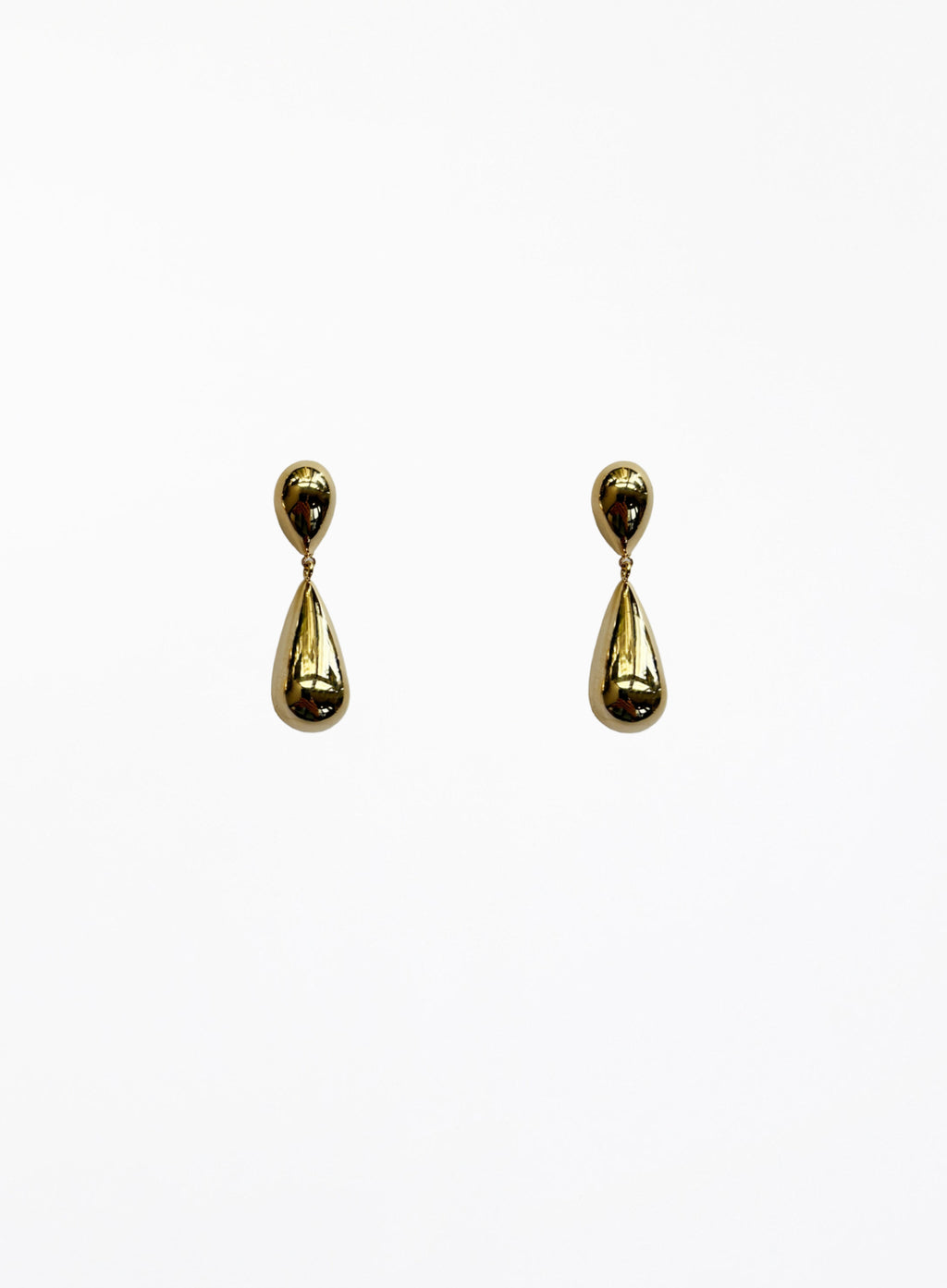 Pair of gold teardrop earrings on a white background