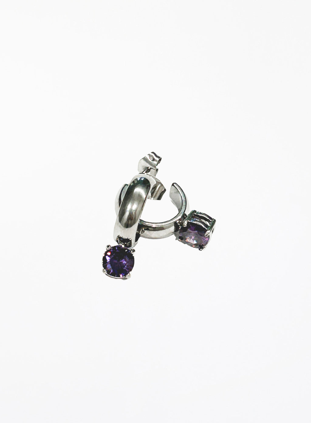 Silver earring with purple gemstones on a white background