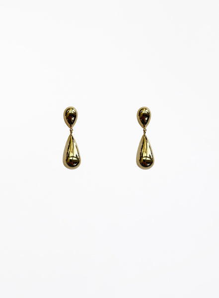 Pair of gold teardrop earrings on a white background