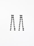 Pair of silver ball chain earrings on a white background