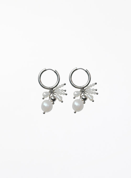 A pair of silver hoop earrings with dangling pearl clusters and small silver beads, shown on a plain white background.