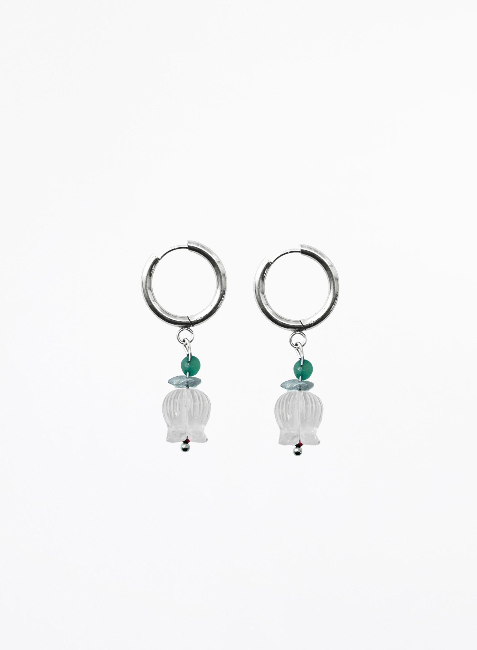 Pair of hoop earrings with hanging beads on a white background