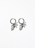 Pair of silver hoop earrings with pearl drops on a white background
