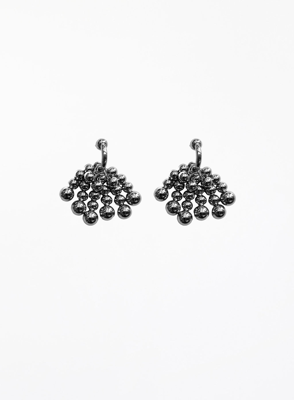 Pair of silver beaded hoop earrings on a white background