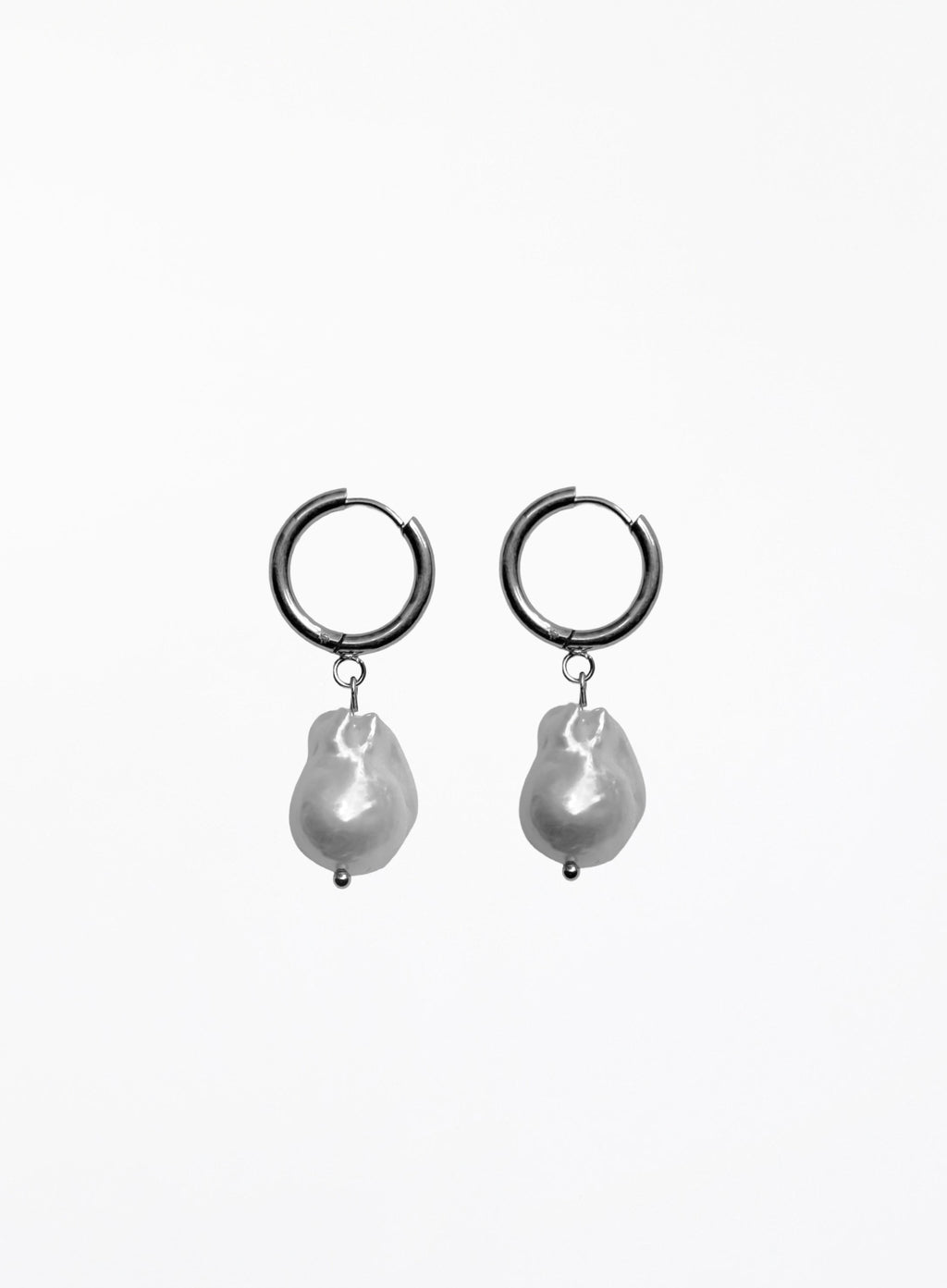 Pair of hoop earrings with baroque pearl drops on a white background