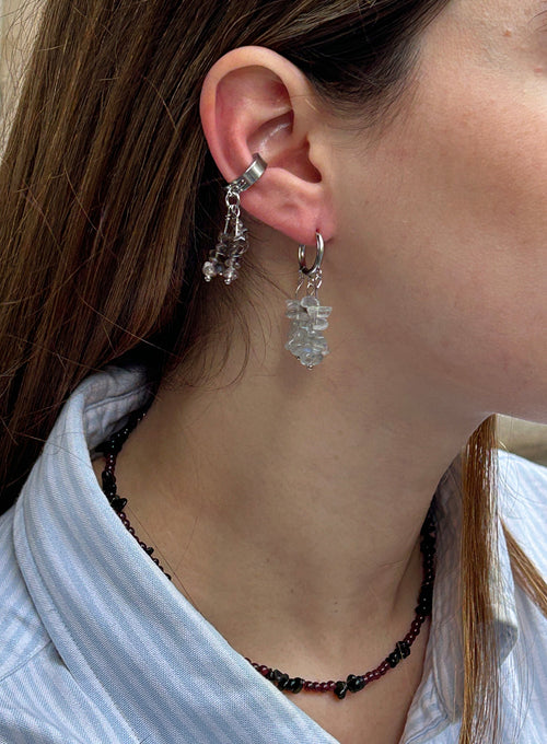 woman wearing abradorite dangle huggie earrings and earcuffs