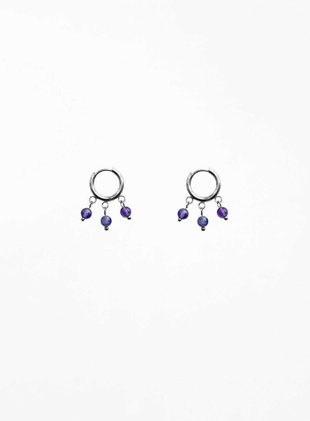Pair of hoop earrings with purple beads on a white background