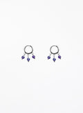 Pair of hoop earrings with purple beads on a white background