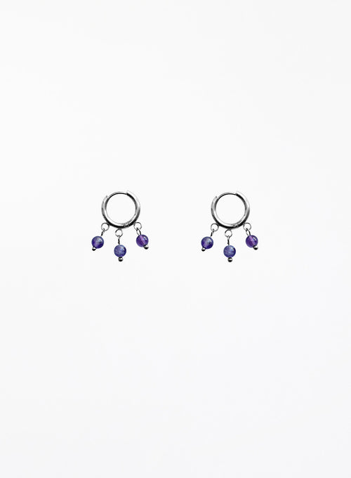 Pair of hoop earrings with purple beads on a white background