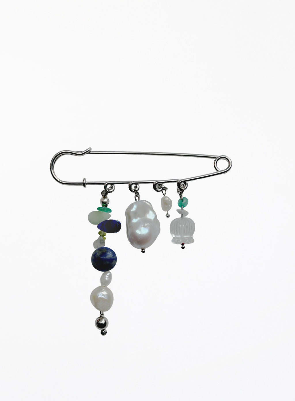 Brooch with pearls and beads on a white background