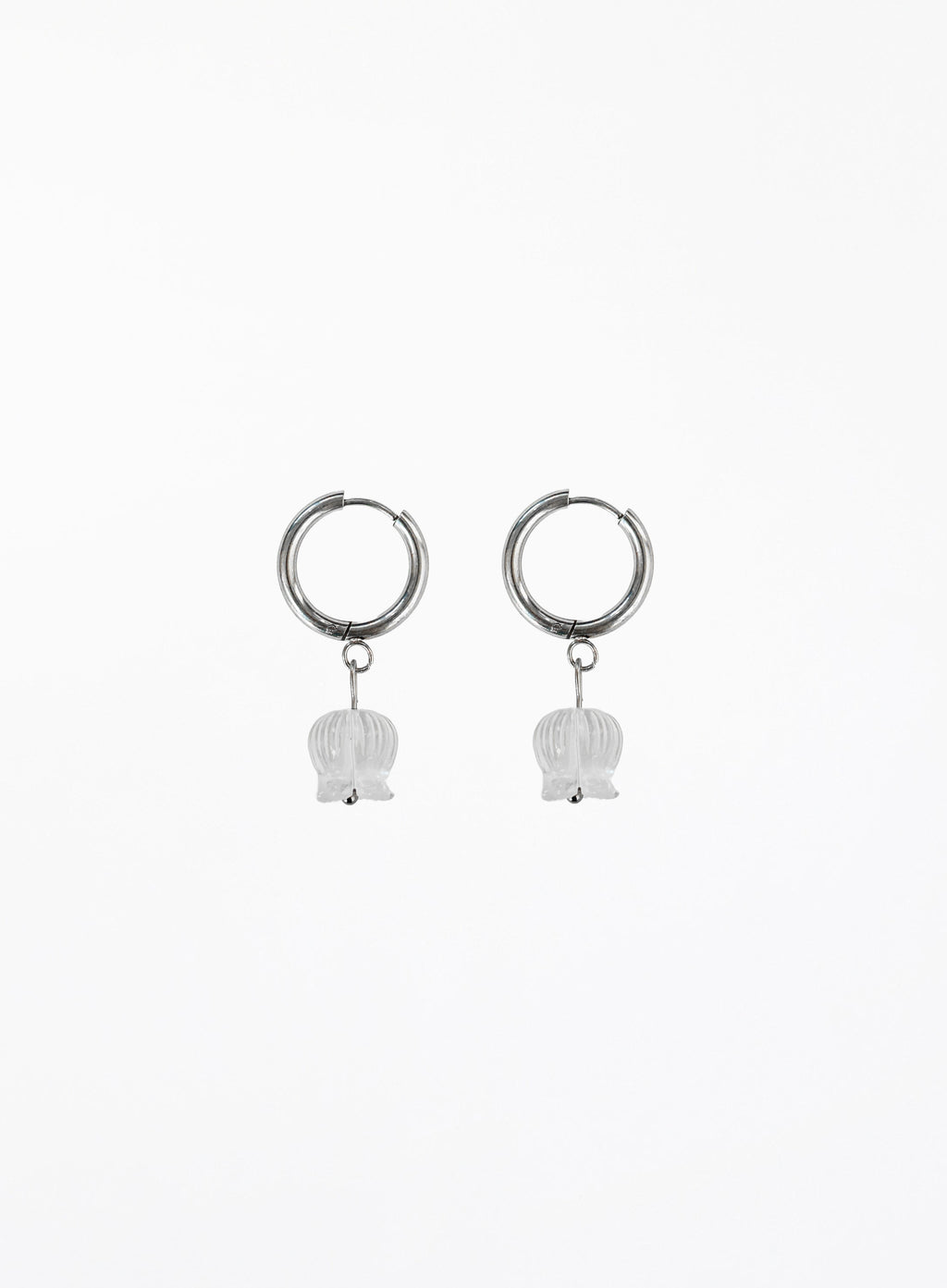 Pair of silver hoop earrings with white bulb-shaped charms on a white background