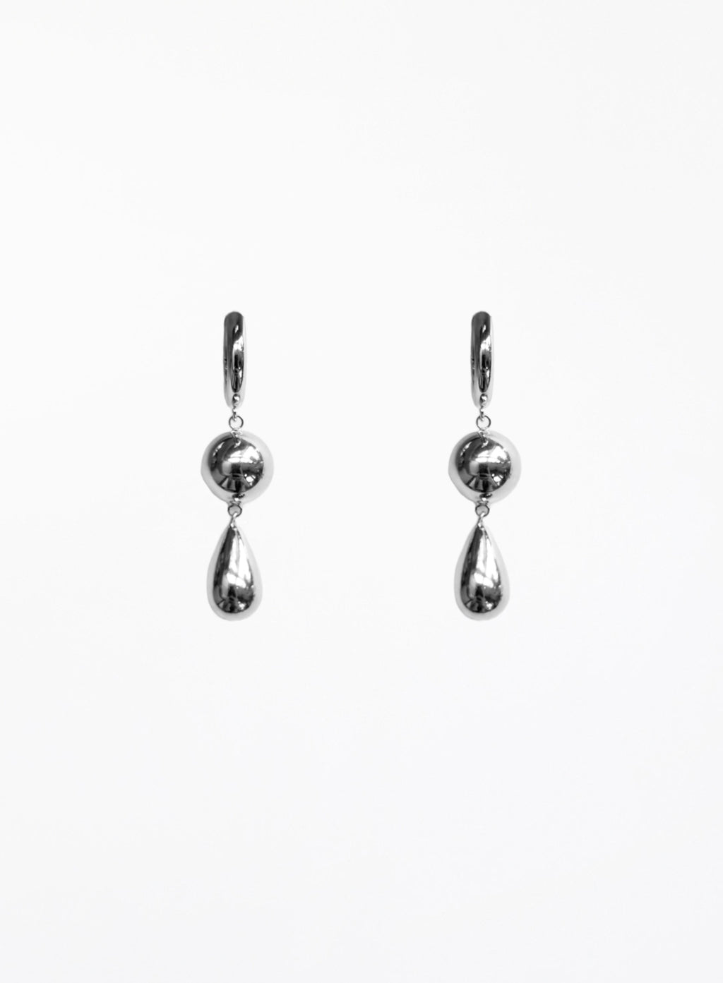 Pair of silver teardrop earrings on a white background