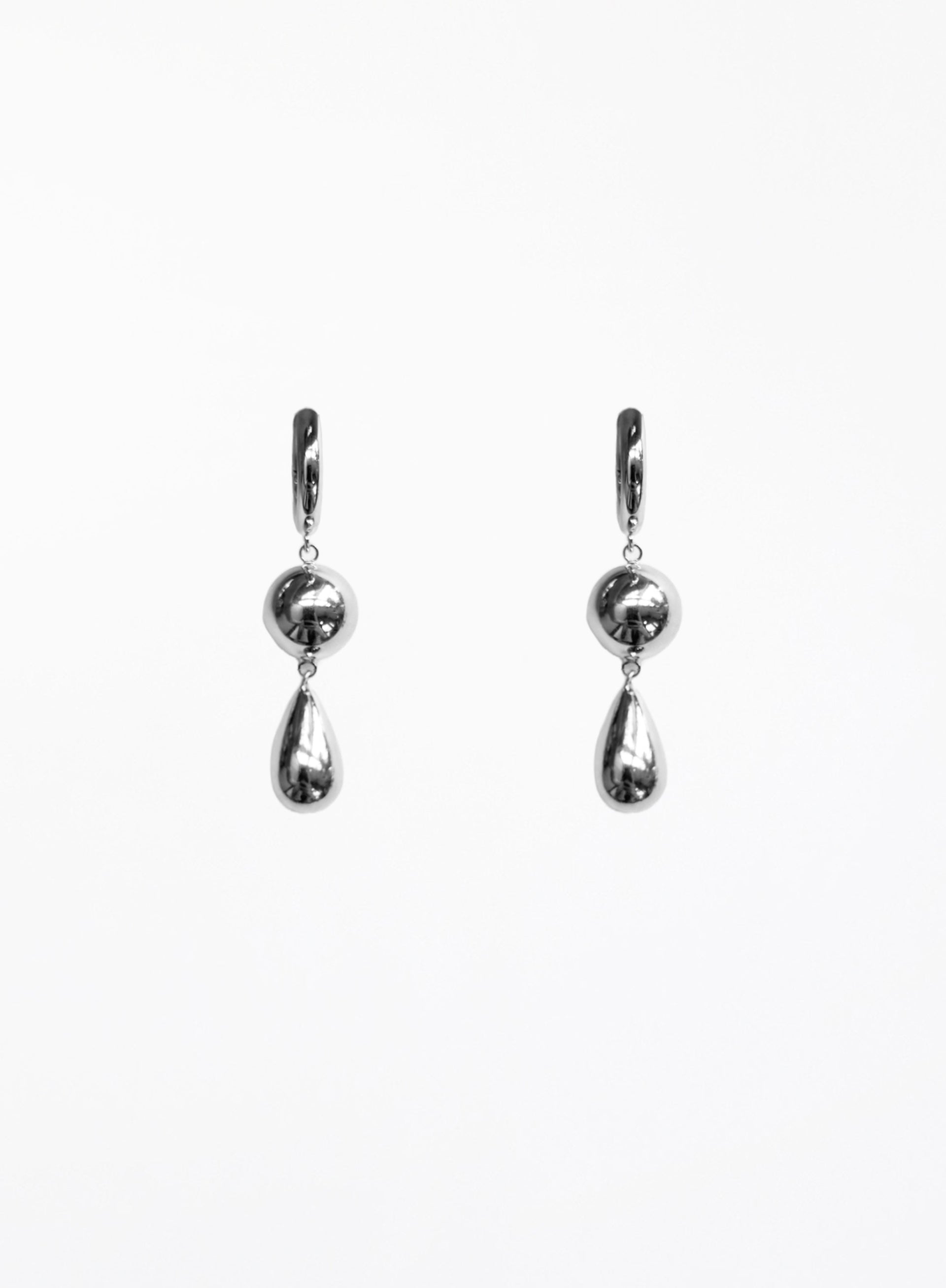 Pair of silver teardrop earrings on a white background
