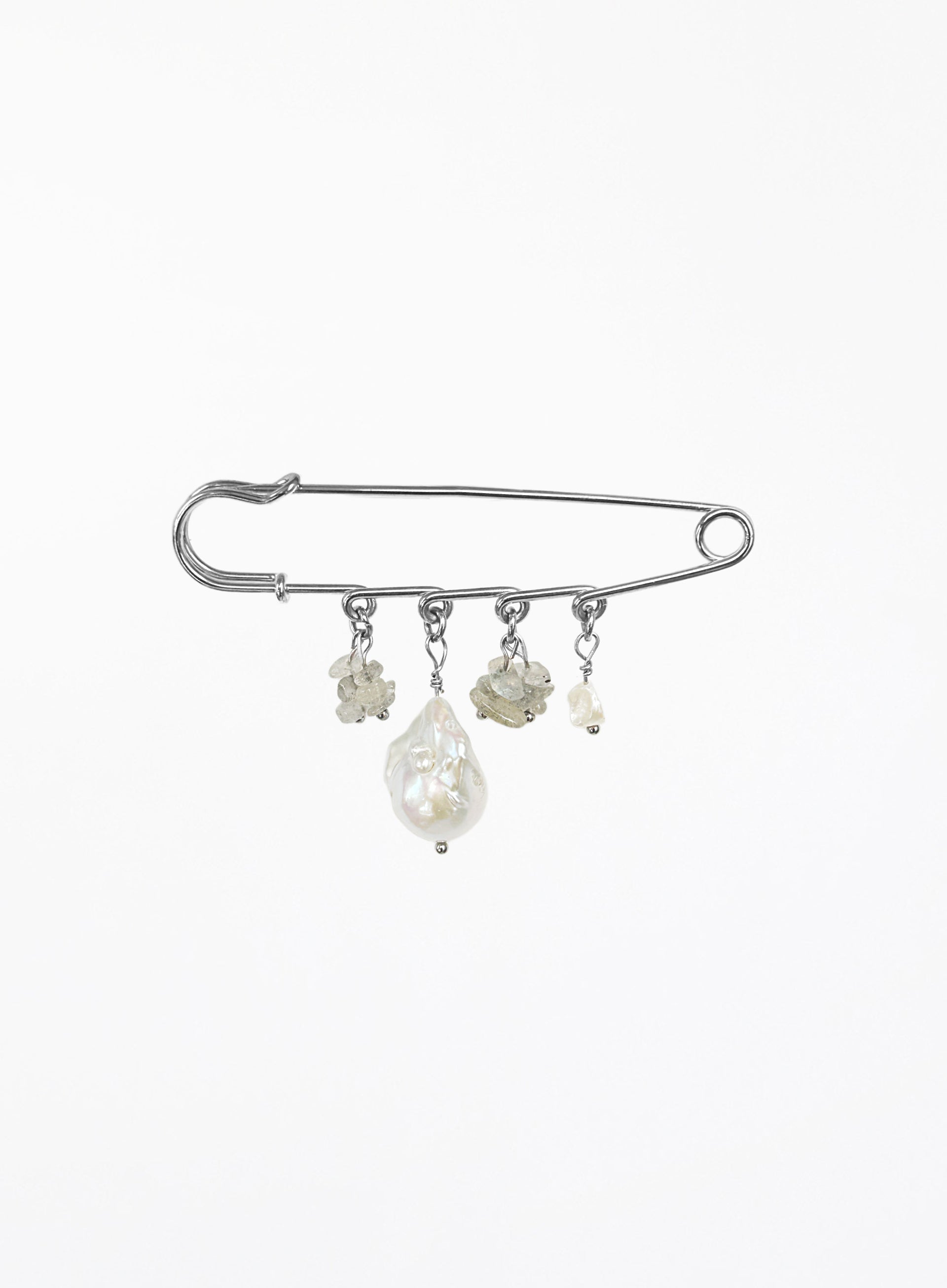 A silver safety pin brooch decorated with four dangling baroque pearl and labradorite beads of varying sizes, set against a plain white background.