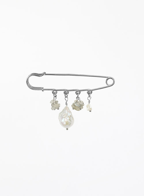 A silver safety pin brooch decorated with four dangling baroque pearl and labradorite beads of varying sizes, set against a plain white background.