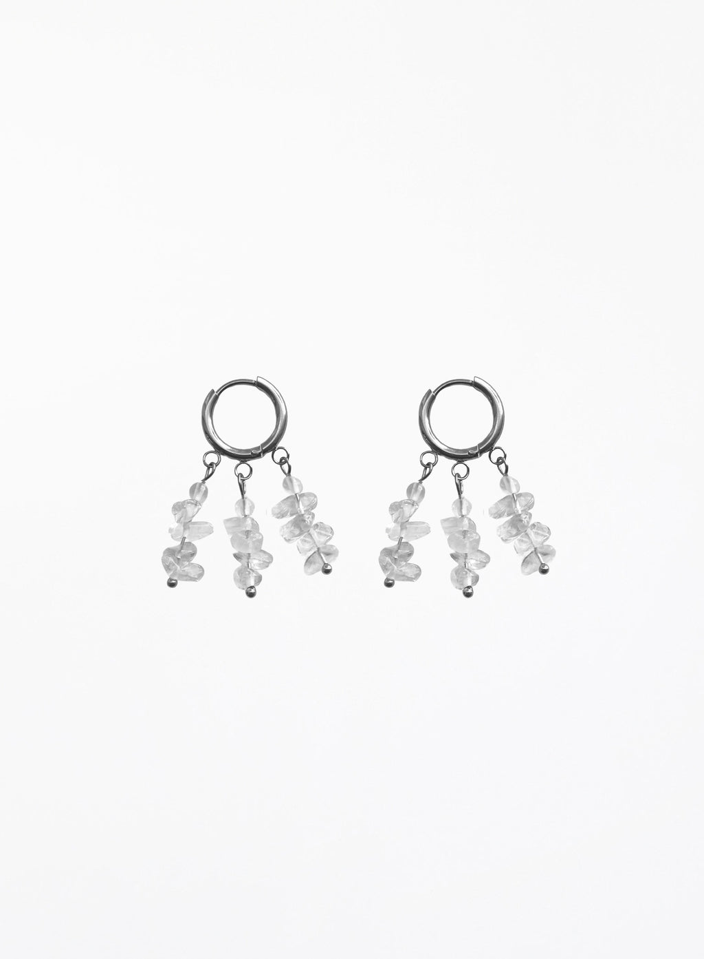 A pair of silver-toned dangle earrings featuring small clear faceted gemstone clusters hanging from open circular hoops, shown against a plain white background.