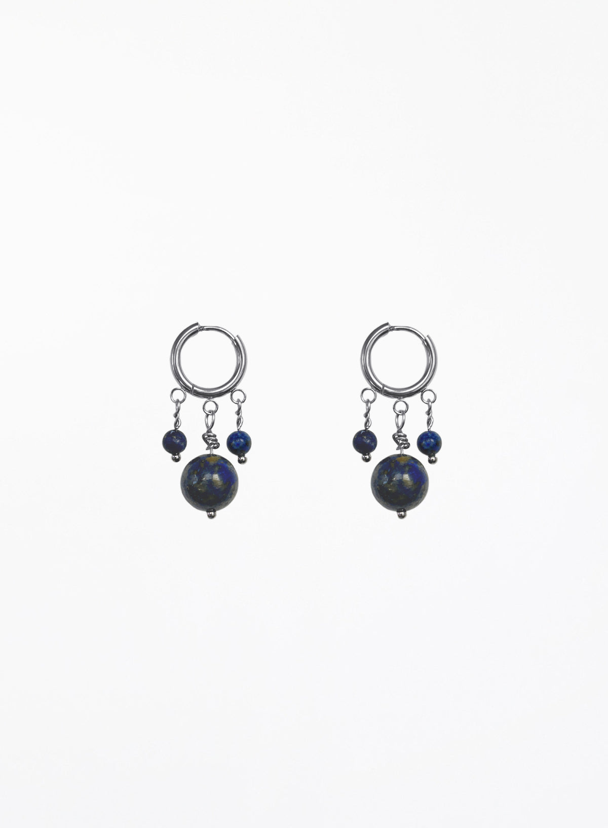 A pair of silver hoop earrings with dangling blue beads and dark round stones, shown against a plain white background.