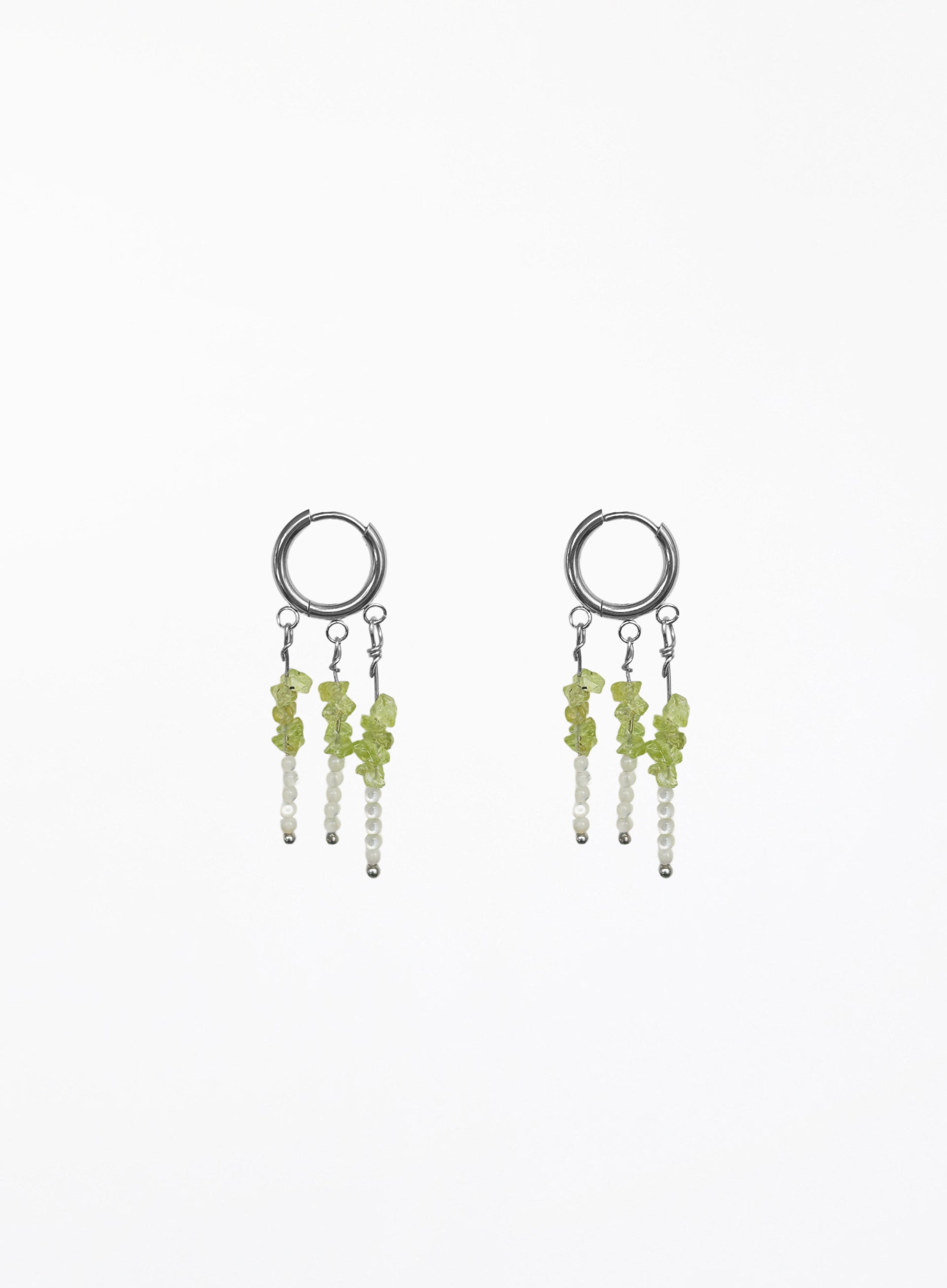 A pair of silver hoop dangle earrings with small green and white beads, shown on a plain white background.