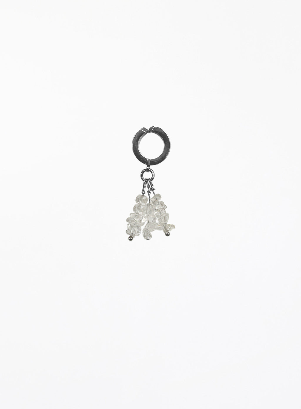 A single silver hoop earring with a dangling cluster of small clear faceted beads, photographed against a plain white background.