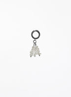 A single silver hoop earring with a dangling cluster of small clear faceted beads, photographed against a plain white background.