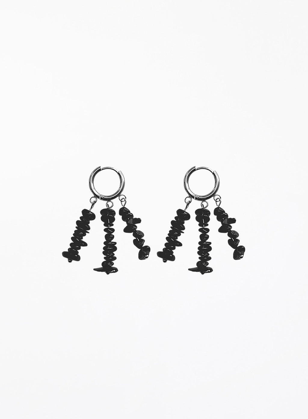 A pair of black dangle earrings with textured, irregularly shaped beads hanging from silver-toned hoop backings, shown against a plain white background.