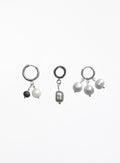 Three pairs of silver hoop earrings with dangling pearl and bead charms, displayed on a clean white background.