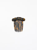 Tortoiseshell comb on a white background