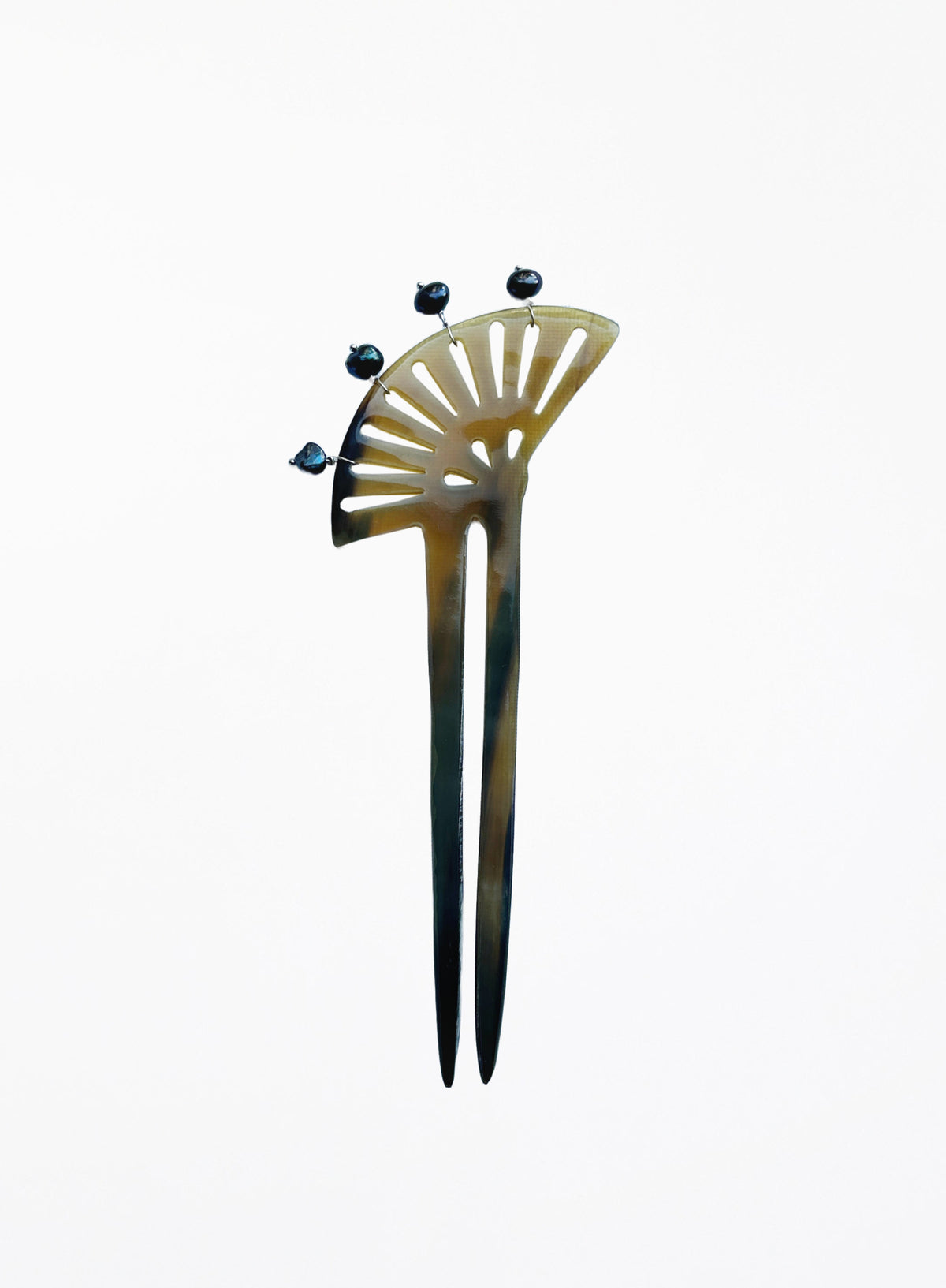 A vintage-style hair pin with a fan-shaped top, featuring a tortoiseshell pattern in amber-brown and black, accented with four small dark pearls at the top.