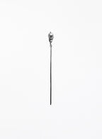 A long, minimalist silver-toned hair pin with natural baroque pearl 