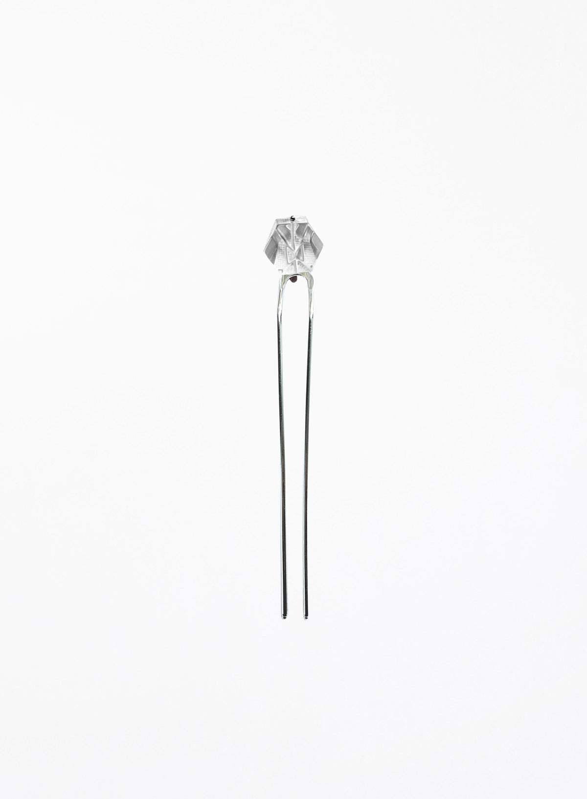 A silver-toned hair pin with a faceted clear crystal top, set against a plain white background.