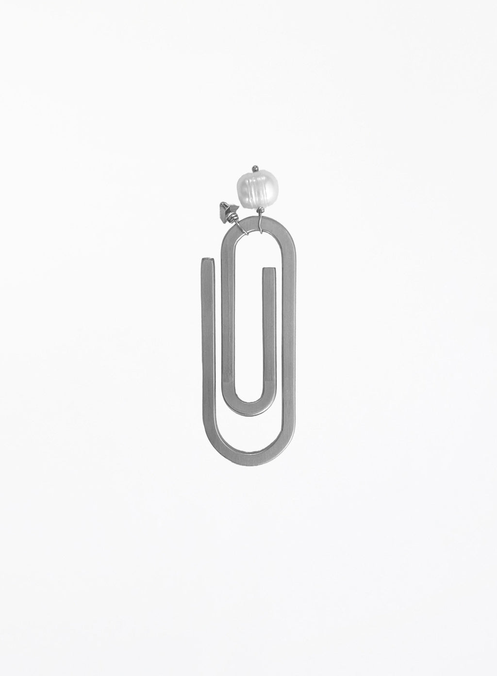 A minimalist steel paperclip-shaped bookmark with a pearl and initial charm shown against a plain white background.
