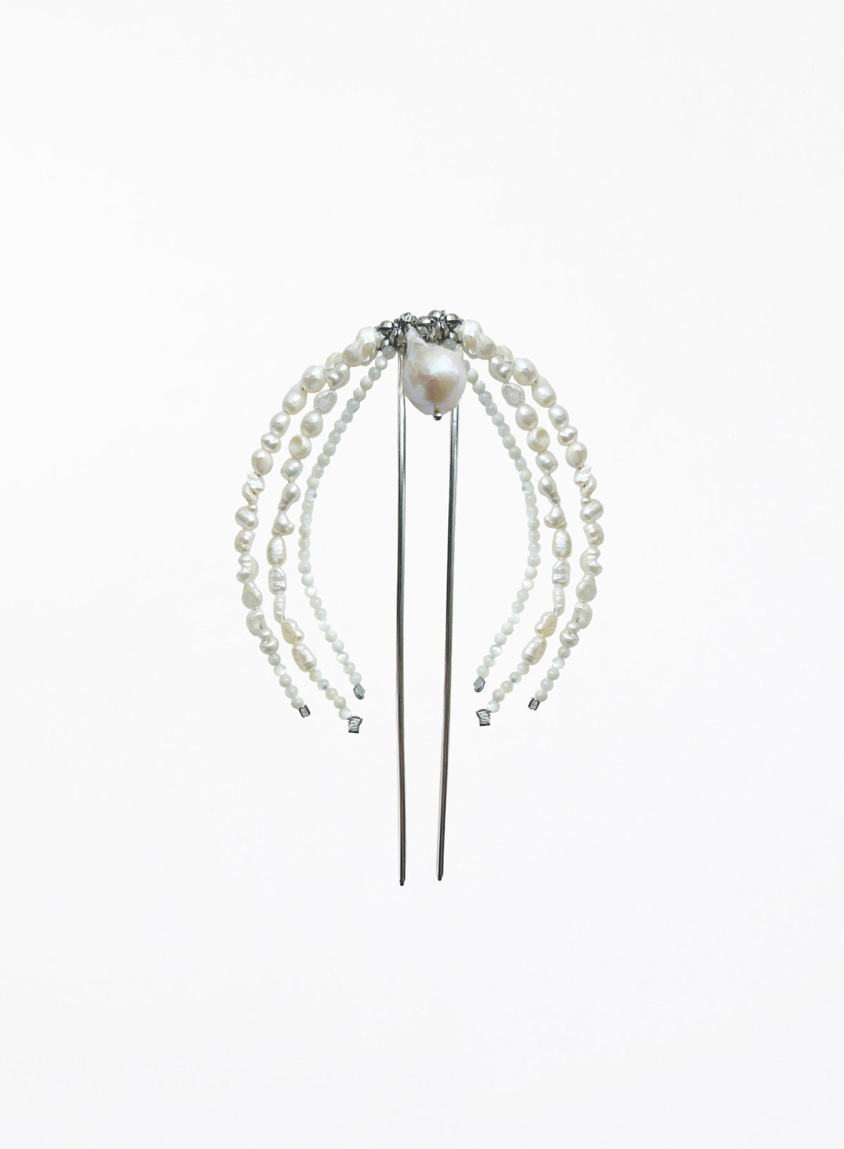 A pearl hair accessory with multiple strands of white freshwater pearls draped over a silver metal hair stick, featuring a central pearl