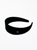 Black headband with a small silver logo on a white background