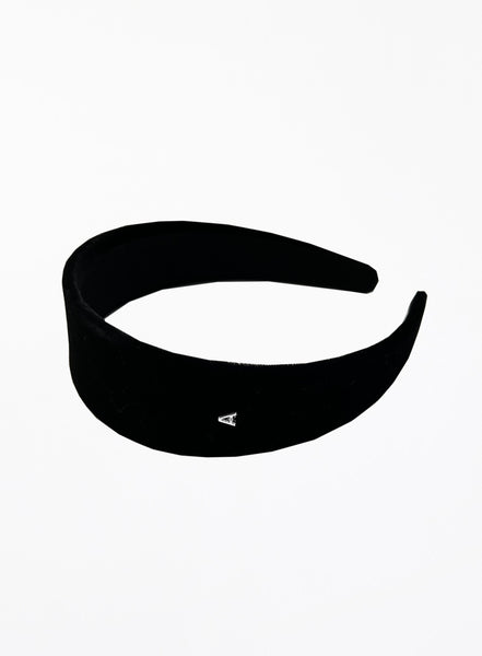 Black headband with a small silver logo on a white background