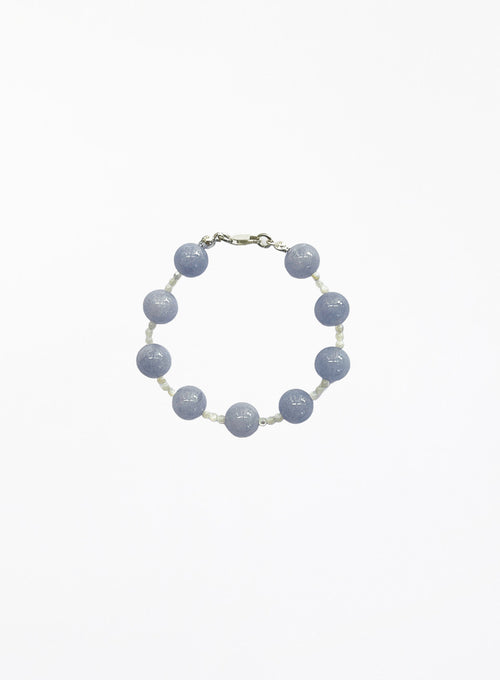 Bracelet with blue beads on a white background